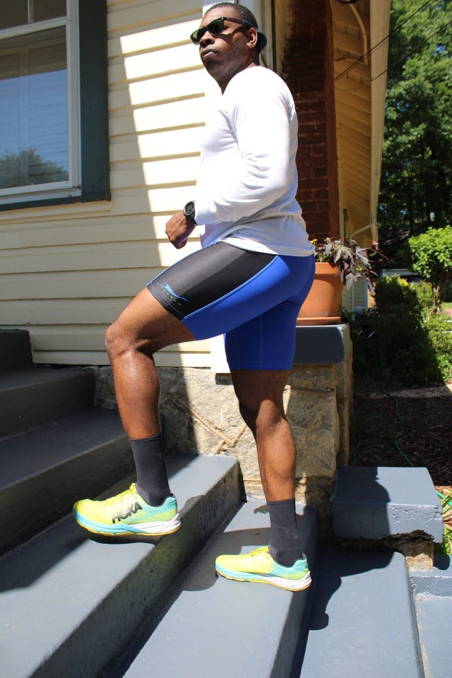 African-American male walking up porch stairs after a run wearing the uber comfortable Herron Apparel running shorts