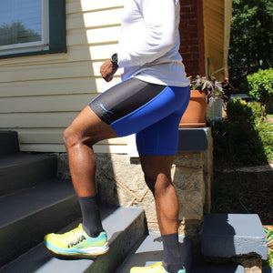 African-American male walking up porch stairs after a run wearing the uber comfortable Herron Apparel running shorts